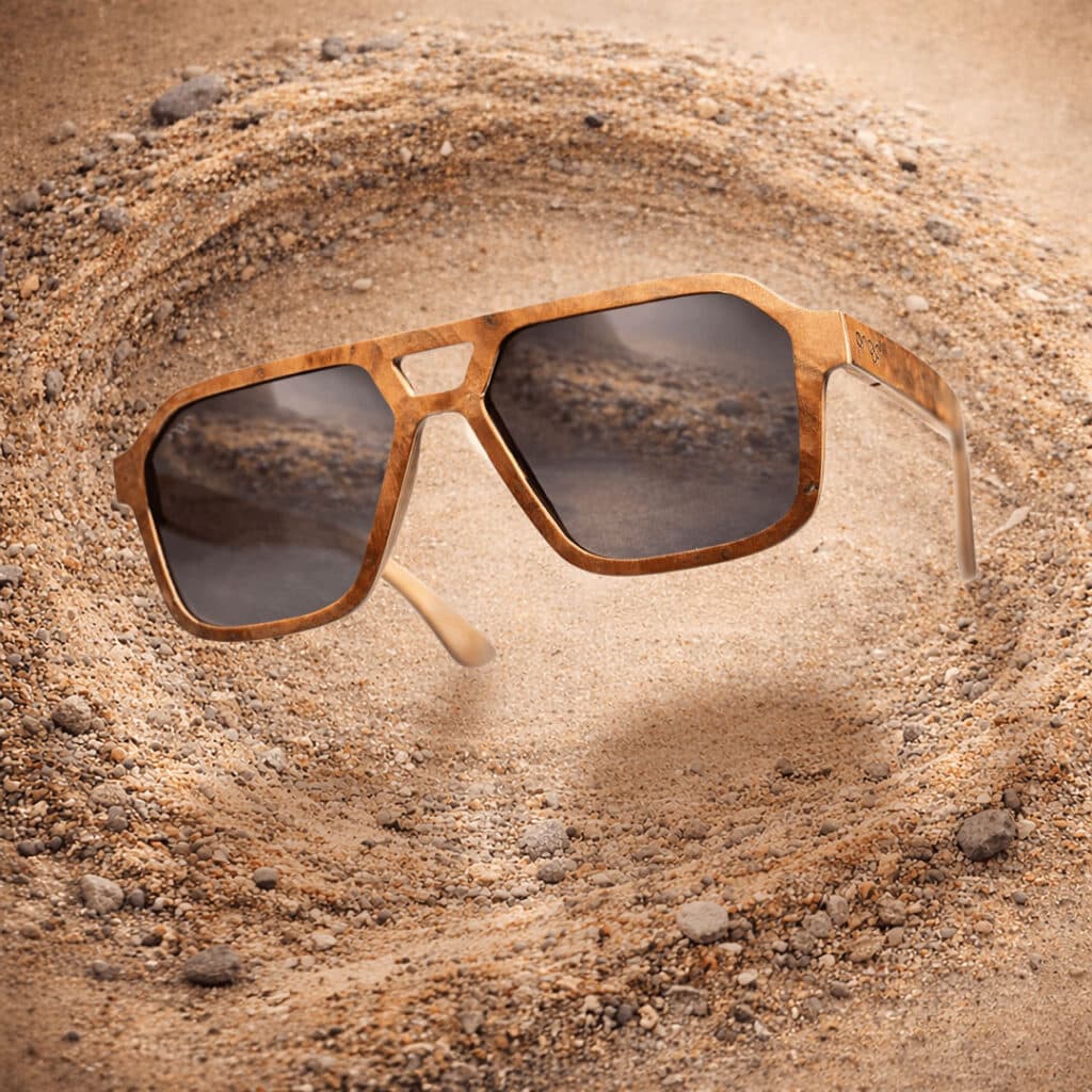 EskerWood-RosewoodBurley-GrayLens Wooden sunglasses that have polarized lens set against swirling sand.