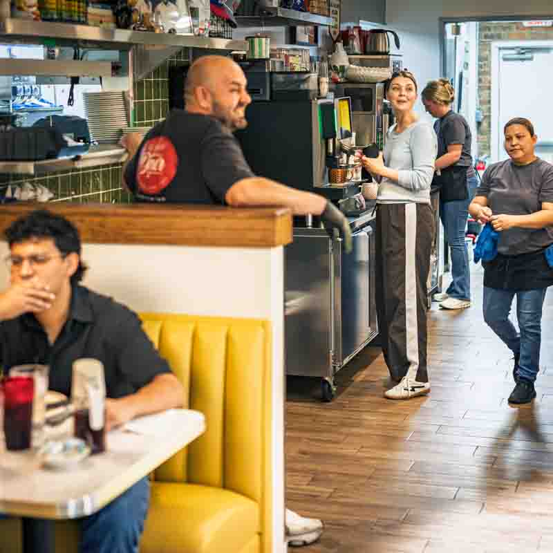 restaurant-lifestyle-daytrip-diner-grapevine-texas restaurant staff greeting a customer